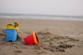 red and blue toy bucket for kid on sand beach Royalty Free Stock Photo