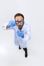 High angle view of young chemist, doctor conducts chemical research isolated on white background. Concept of Royalty Free Stock Photo