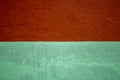 A red-blue two-tone concrete wall. rough texture. paint spots Royalty Free Stock Photo