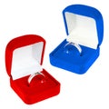 Red and blue velvet boxes with platinum ring