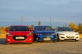 Red, blue and white cars