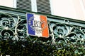 Red blue white French coat of arms flag on city hall in france facade building in town