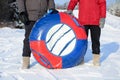 Red and blue winter inflatable tube for downhill skiing, close-up. an active lifestyle