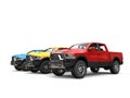 Red, blue and yellow modern pick-up trucks - beauty shot Royalty Free Stock Photo