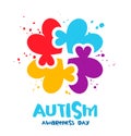 Red, blue, yellow and purple puzzle piece in the shape of a heart. Multicolored splashes of colors. Autism Awareness Day Royalty Free Stock Photo