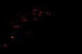 Red blurred bokeh lights on black background. Glitter sparkle confetti Royalty Free Stock Photo