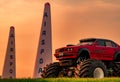 Red BMW car 4x4 bigfoot parked on green grass in Air Race 1 World Cup Thailand 2017 at U-Tapao Naval Air Base Royalty Free Stock Photo