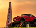 Red BMW car 4x4 bigfoot parked on green grass in Air Race 1 World Cup Thailand 2017 at U-Tapao Naval Air Base