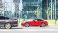 Red BMW Z4 G29 roadster car on the city street. Fast moving sports car on urban road with blurred background