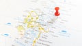 A red board pin stuck in the island of stronsay on a map of Scotland Royalty Free Stock Photo