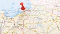 A red board pin stuck in Kaliningrad in a map of Russia