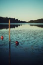 Red boat buoy in lake quiet evening