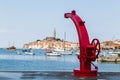 Red boat crane frames Rovinj