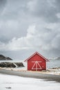 Red boat House on a norwegian coast during winter day Royalty Free Stock Photo