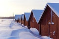 Red Boat Houses on the Frozen Shore in Finland Royalty Free Stock Photo