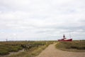 Red boat in marshes