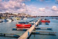 A red boat moored on a jetty in the marina of Ramsgate Royal Harbour, Kent, Uk. Royalty Free Stock Photo