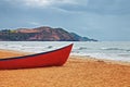 Red boat on a sandy beach Royalty Free Stock Photo