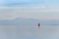 Red boat at sundown at lake Garda, Italy Royalty Free Stock Photo