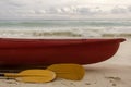 Red boat and yellow paddle Royalty Free Stock Photo