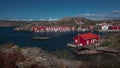 Red boathouses at the coast of the archipelago island of TjÃ¶rn in the west of Sweden
