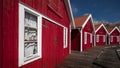 Red boathouses on the archipelago island of TjÃ¶rn in the west of Sweden