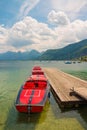 Red boats on mountain lake Wolfgangsee, Austria Royalty Free Stock Photo