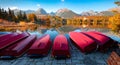 Red boats on the pier. Colorful autumn scene of Strbske pleso lake. Panoramic morning view of High Tatras National Park, Slovakia, Royalty Free Stock Photo