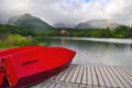 Red boats by Strbske Lake water Tatra mountains Royalty Free Stock Photo