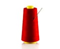 Red bobbin with thread and needle Royalty Free Stock Photo