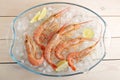 Red boiled shrimp with lime on ice Royalty Free Stock Photo