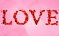 Red bokeh love word write on pink hearts shape background, valentine day holiday event Royalty Free Stock Photo