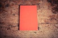 Red book on a wood table Royalty Free Stock Photo