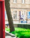 red booth in front of a building, on the street, blurred background Royalty Free Stock Photo