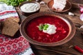 red borscht with beetroot tomato and meat wooden table