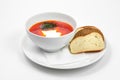 Red borscht soup with dill in white bowl. Royalty Free Stock Photo