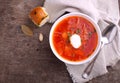 Red borscht soup in white bowl with sour cream Royalty Free Stock Photo