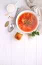Red borscht soup in white bowl with sour cream Royalty Free Stock Photo