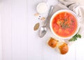 Red borscht soup in white bowl with sour cream Royalty Free Stock Photo