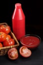 Red bottle and tomatoes Royalty Free Stock Photo
