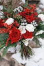 Red bouquet in winter on white snow