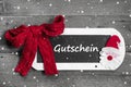 Red bow on chalk board with Voucher - coupon