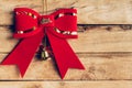 Red bow christmas hanging on wood background with copyspace.,han Royalty Free Stock Photo