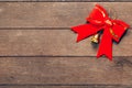 Red bow christmas on wood background Royalty Free Stock Photo