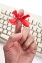 Red bow on finger Royalty Free Stock Photo