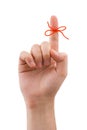 Red bow on finger Royalty Free Stock Photo