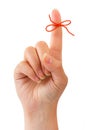 Red bow on finger Royalty Free Stock Photo