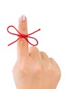 Red bow on finger Royalty Free Stock Photo