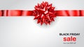 Red bow with horizontal ribbon with shadow and inscription Black Friday Sale