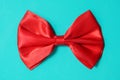 Red bow ite on green background Royalty Free Stock Photo